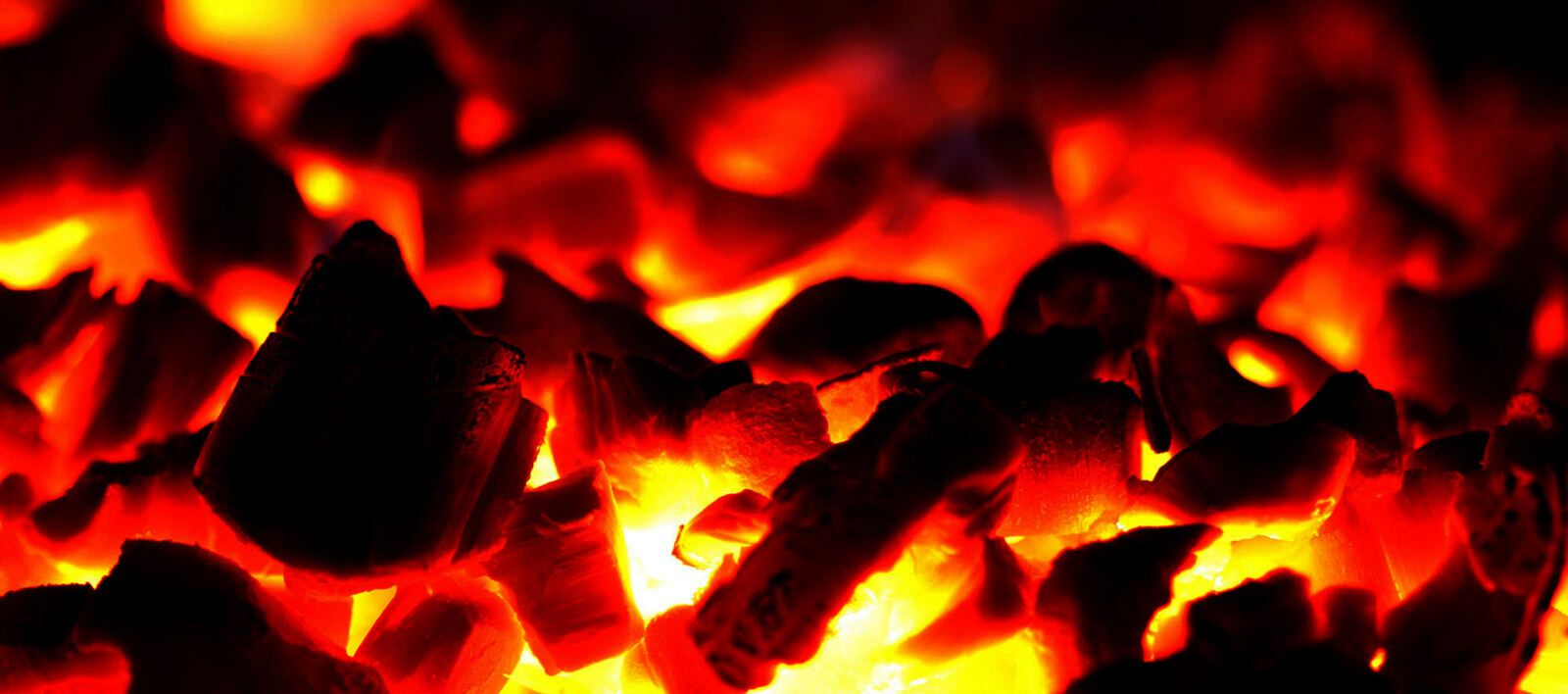 Glowing lump charcoal ready for cooking
